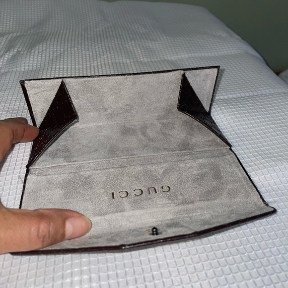 brown leather monogrammed foldable eyeglasses case from Gucci. - Picture 7 of 16